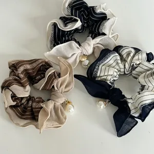 Three-piece retro striped hair scrunchie set with large bows and faux pearl pendants