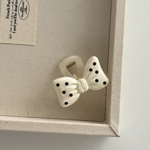 Polka dot bow hair claw clip in creamy white finish for elegant women hairstyles