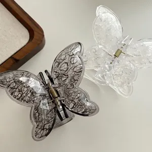 Elegant set of black and white lace butterfly hair claw clips with gold metal spring