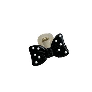 Sweet polka dot bow hair claw clip for women in black and white minimalist style