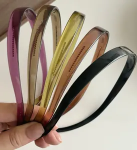 Close-up of flexible resin headbands with non-slip teeth in five different colors