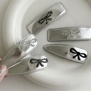 5-piece silver leather bow hair clips with rhinestones and minimalist metallic finish