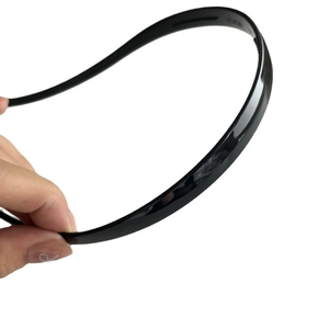 Minimalist black glossy anti-slip headband with fine teeth for secure everyday wear