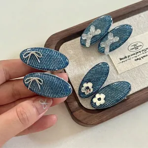 Denim fabric hair clips featuring silver bows and sequins for women and girls