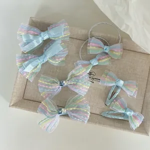 Set fermagli fiocco in organza blu con cuciture colorate e strass per bambine