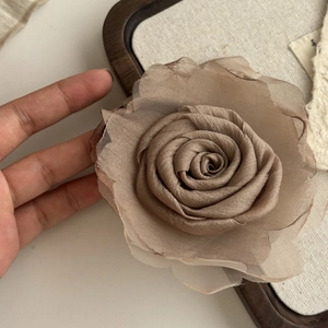 Detailed close-up of a Morandi brown layered mesh rose hair claw clip with chiffon petals