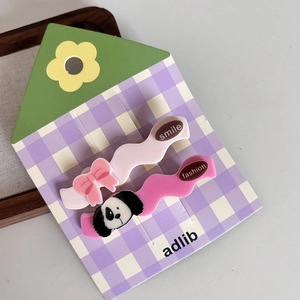 Set of two pink acrylic wave hair clips with cute bow and cartoon dog designs