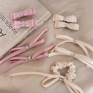 Elegant satin bow hair clip set with pearls and rhinestones in pink and cream beige