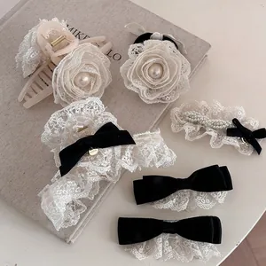 Detail of sweet white lace floral hair clip and pearl ribbon accessories set
