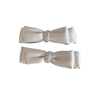 Elegant satin bow hair clips with faux pearls set in creamy champagne silk finish