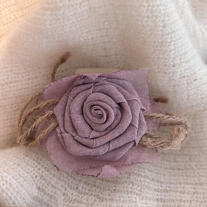 Handmade dried rose hair claw in vintage pink fabric with rustic rope accent