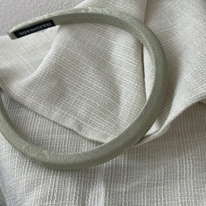 Elegant Neo-Chinese style light green satin headband with fine texture and handmade label