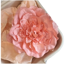 Pink peony hair clip in a paper box for vacation styling and beach photography