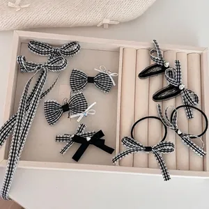 Checkered bow hair clip set with rhinestones and black and white patterns for women