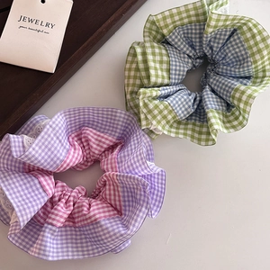 Plaid checkered scrunchies with white lace trim in pastel purple and mint green colors