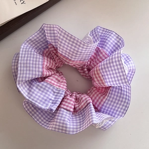 Sweet purple and pink gingham scrunchie with lace edge detail on white background