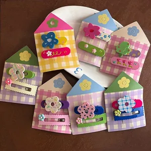 Lot de 16 pinces à cheveux cartoon avec ours mignons, fleurs et cœurs aux couleurs pastel doux