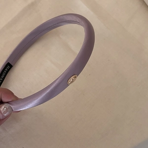 Elegant lavender silk padded headband with handmade label and golden metal logo detail
