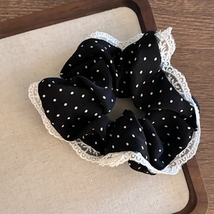 Vintage black polka dot scrunchie with white lace trim for elegant ponytails