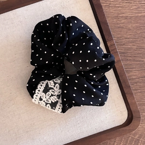 Retro black polka dot scrunchie with white lace trim for elegant women ponytail hairstyle