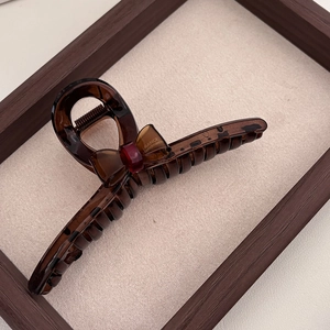 Brown tortoiseshell hair claw clip with bow and France handmade gold lettering detail