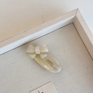 Elegant pearl white acetate bow hair clip with French handmade lettering for women