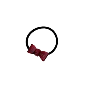 Elegant burgundy resin bow hair tie with black elastic band and gold handmade lettering