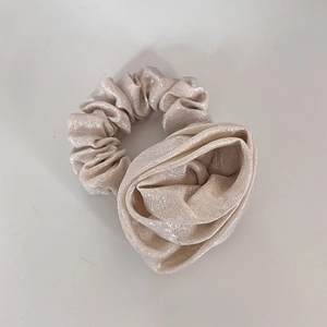 Elegant champagne rose flower hair scrunchie with shimmering metallic fabric detail