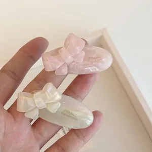 Pink and ivory pearlescent acetate bow hair clip with France Handmade lettering style