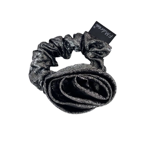 Elegant dark grey rose scrunchie with metallic shimmer fabric and a stylish woven label