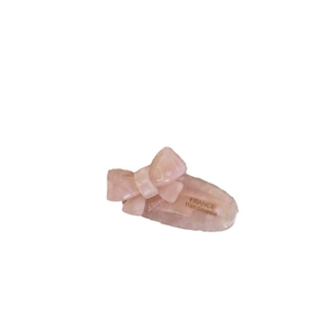 Pale pink translucent acetate bow hair clip with FRANCE Handmade engraving in white background