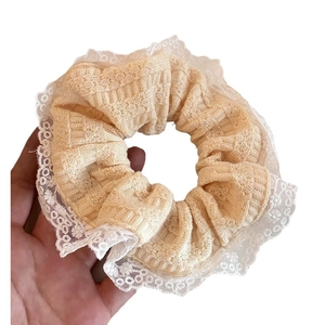 Floral lace trim scrunchie in beige knit fabric for elegant ponytail hair styling