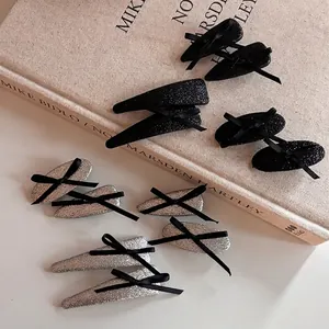 Elegant silver and black glitter ribbon hair clips set with aesthetic bow details