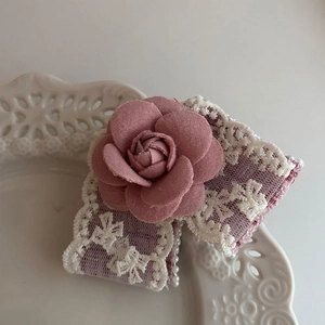 Elegant Morandi pink camellia hair clip with white lace bow and pearl accents