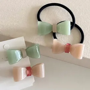 Jelly color bow hair clip and elastic band set in mint green and powder pink resin