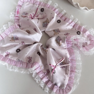Macro shot of pink floral scrunchie featuring handmade lace edges and bear patterns