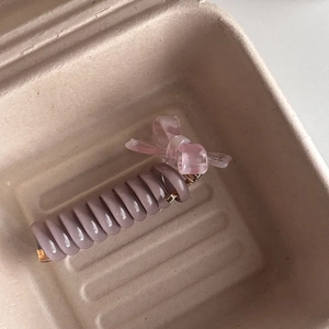 Pink marble bow knot with lilac spiral hair tie in a stylish kraft gift box