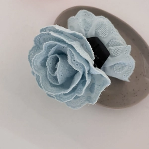 Elegant mint blue fabric flower hair claw clip with delicate hollow embroidery details
