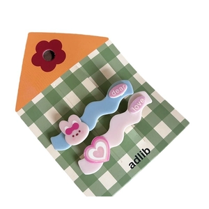Cute cartoon rabbit and heart hair clip set with wavy design on a display card