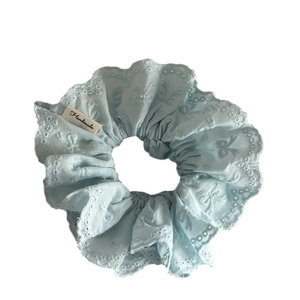 Sky blue floral scrunchie with lace trim and handmade label for girls' hairstyles