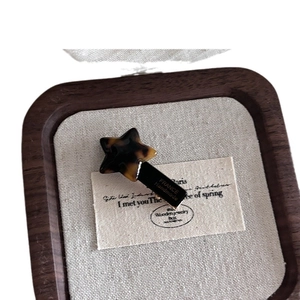 Star-shaped acetate hair clip with tortoiseshell texture and handmade finish for women