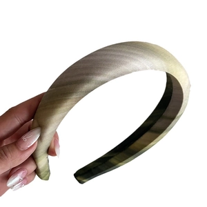 Padded silk texture headband featuring light green and grey gradient striped design