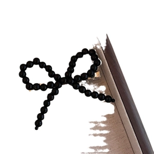 Handcrafted black pearl beaded bow hair clip with silver metal alligator grip for women