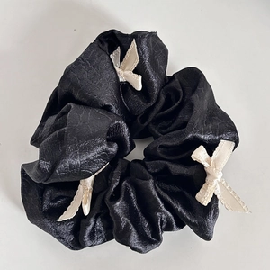 French style black scrunchie with cream white bows and textured pleated fabric design