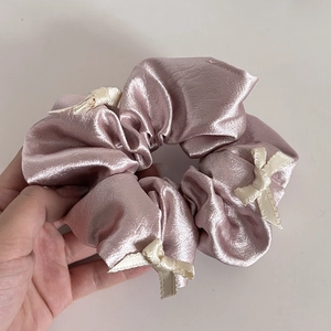 Pink purple satin scrunchie with cream white bows for elegant ballet style hairstyles