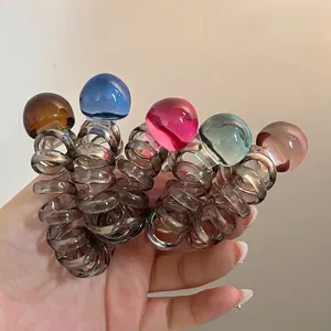 Five-piece spiral hair tie set with translucent heart-shaped beads in multiple colors