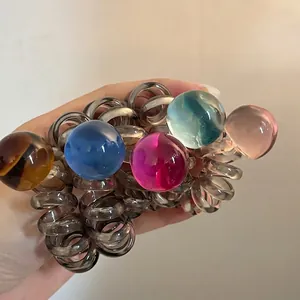 Translucent spiral phone cord hair ties with colorful decorative resin ball charms