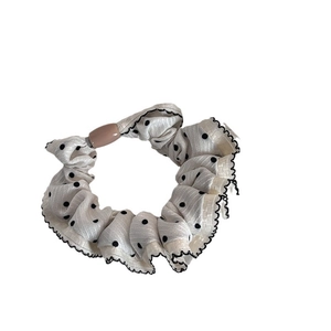 Elegant polka dot hair scrunchie with black wavy edges and a pink resin cylinder bead
