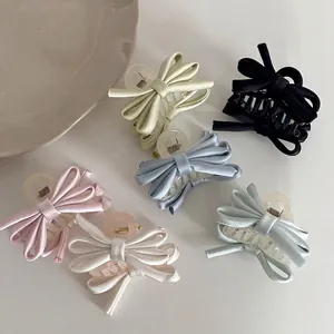 Set of 6 ballet style satin bow hair clips in multiple colors for a voluminous look