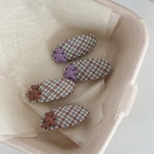 Set of 4 cute plaid fabric hair clips with 3D bear decorations in purple and brown colors